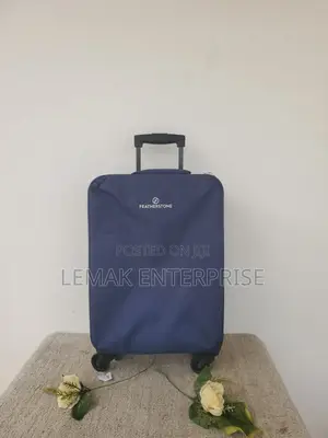 Featherstone 4-Wheel Soft Suitcase/ Traveling Bag. Color Navy Blue.