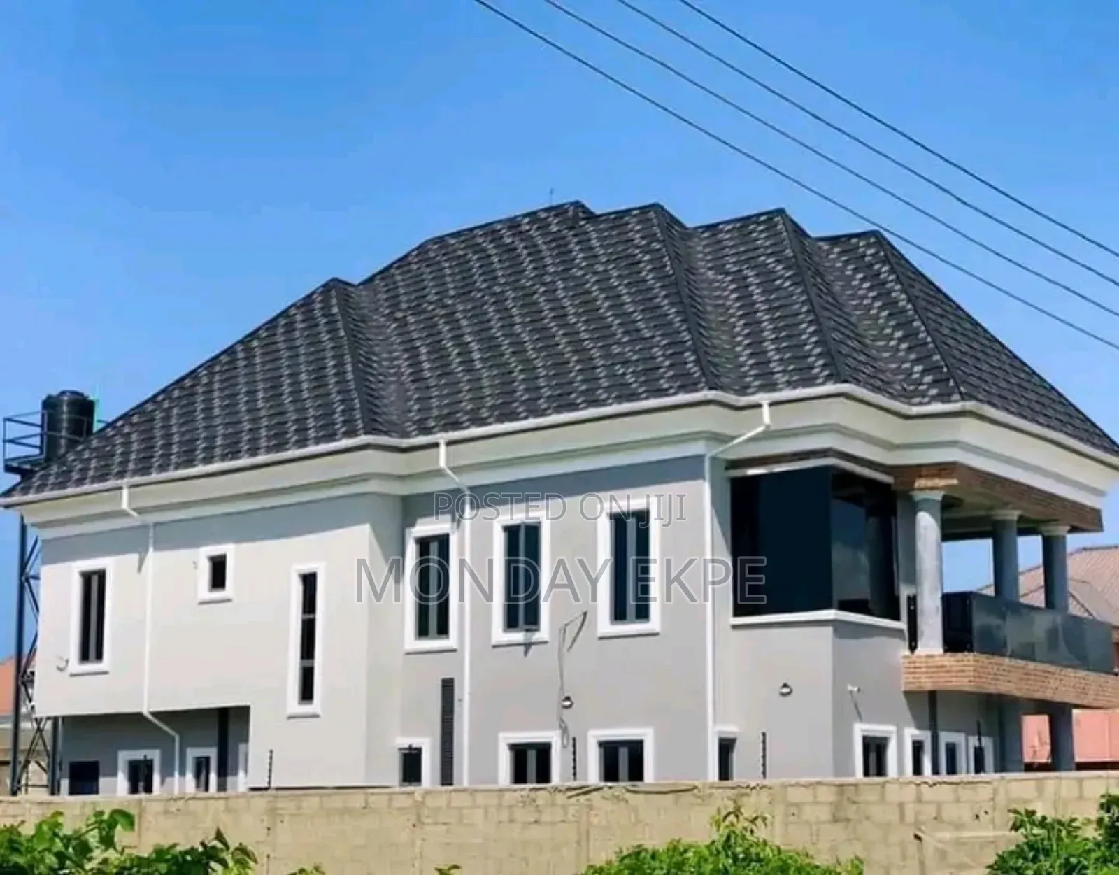 Black and White Shingles Euro Tiles and Rain Gutter