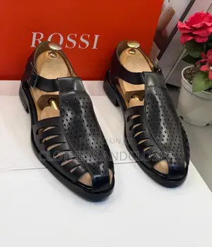 Black Leather Sandals Feature a T-Strap Design