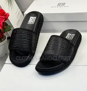 Black Givenchy Slides Feature a Prominent Monogram Embossed Pattern