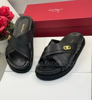 Salvatore Ferragamo Sandals Feature a Black Cross-Strap Design