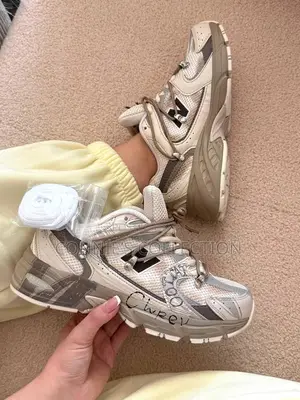 Beige and White New Balance 530 Sneaker