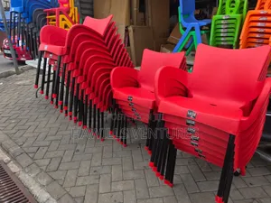 Red Colour Luxe Plastic Chair Feature Black Metal Legs.