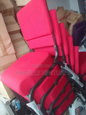 Red Fabric Cushioning and Stackable Chair.