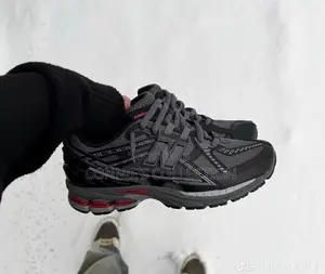 New Balance 1906u Sneakers in a Black and Grey