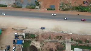Busy Main Road Side 2 and Half Plots for Sale at Adenta