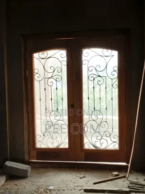 Special Wooden Door (With Metal Designing and Glass Framing )