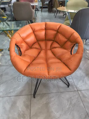 The Orbit Tufted Accent Chair