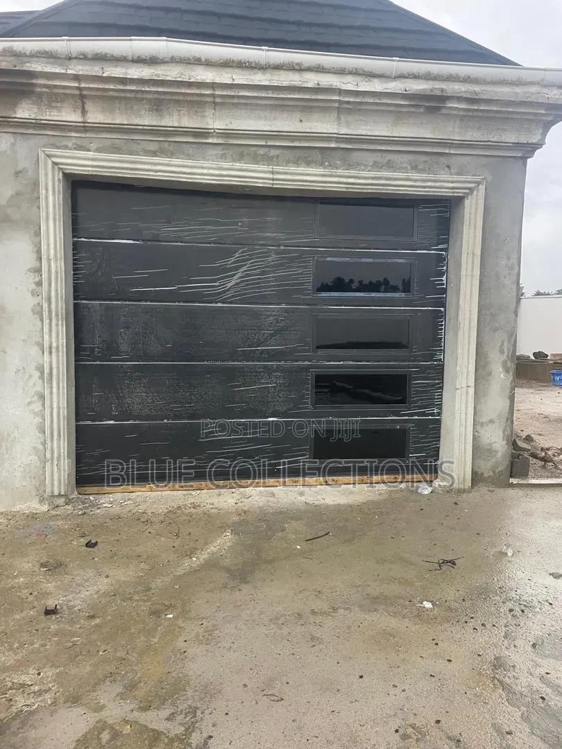 Black Garage With Side Fanlight