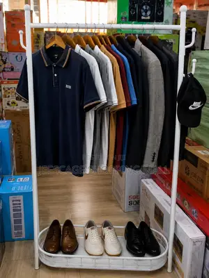 Modern White Metal Garment Rack With Shoe Shelf and Coat Hooks