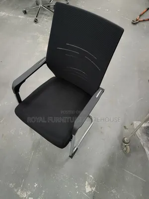 Black Cantilever Visitor's Or Conference Chair With A Chrome Frame.