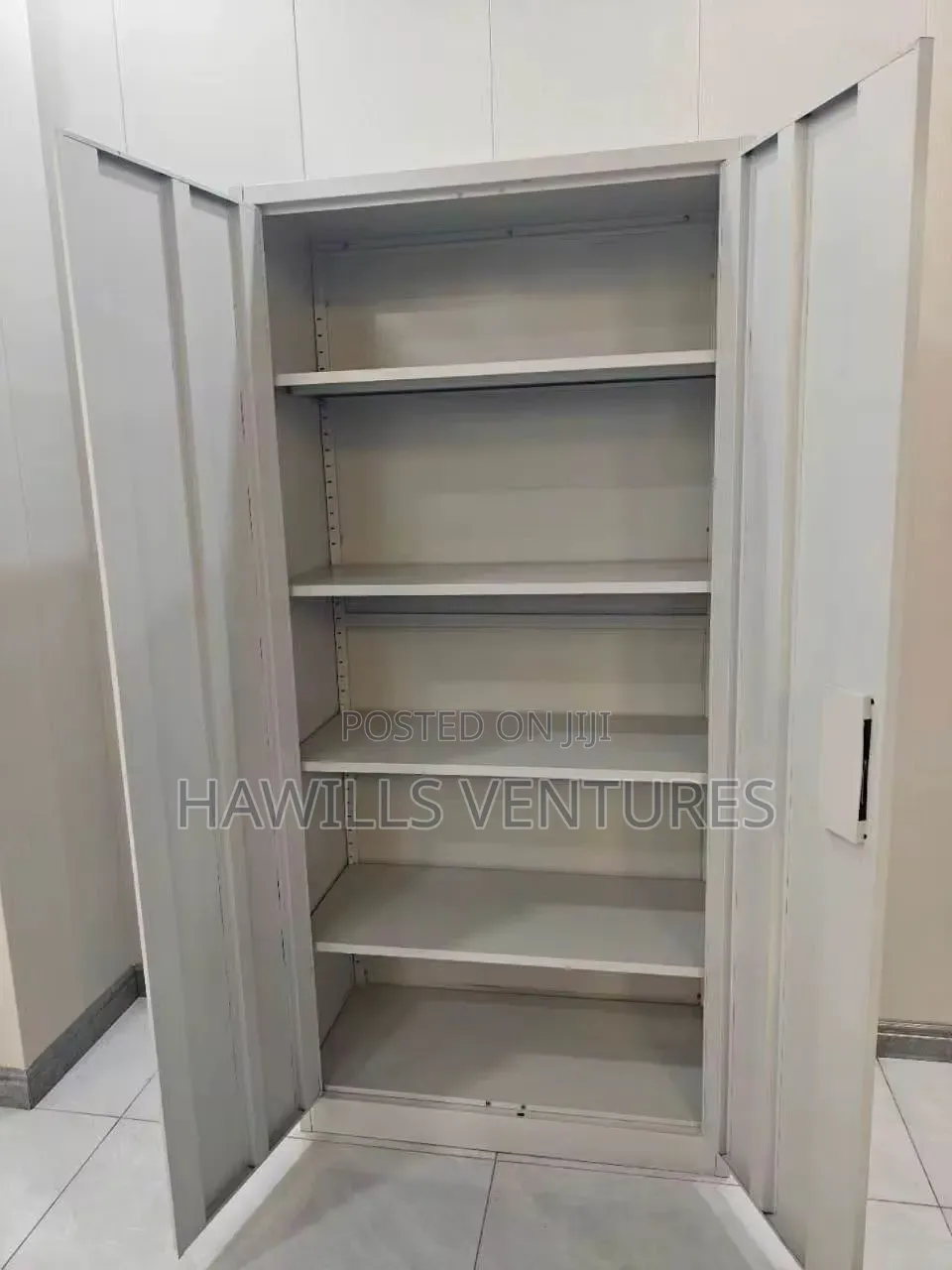 Double -Door Metal Cabinet Featuring a Central Lock Mechanism.