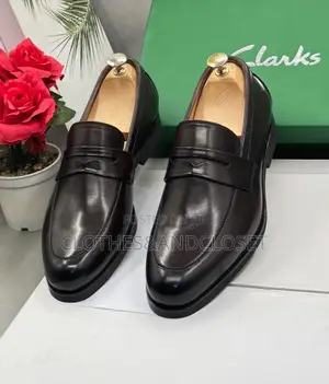 Clarks Black Leather Penny Loafers Featuring a Classic Slip-on Design