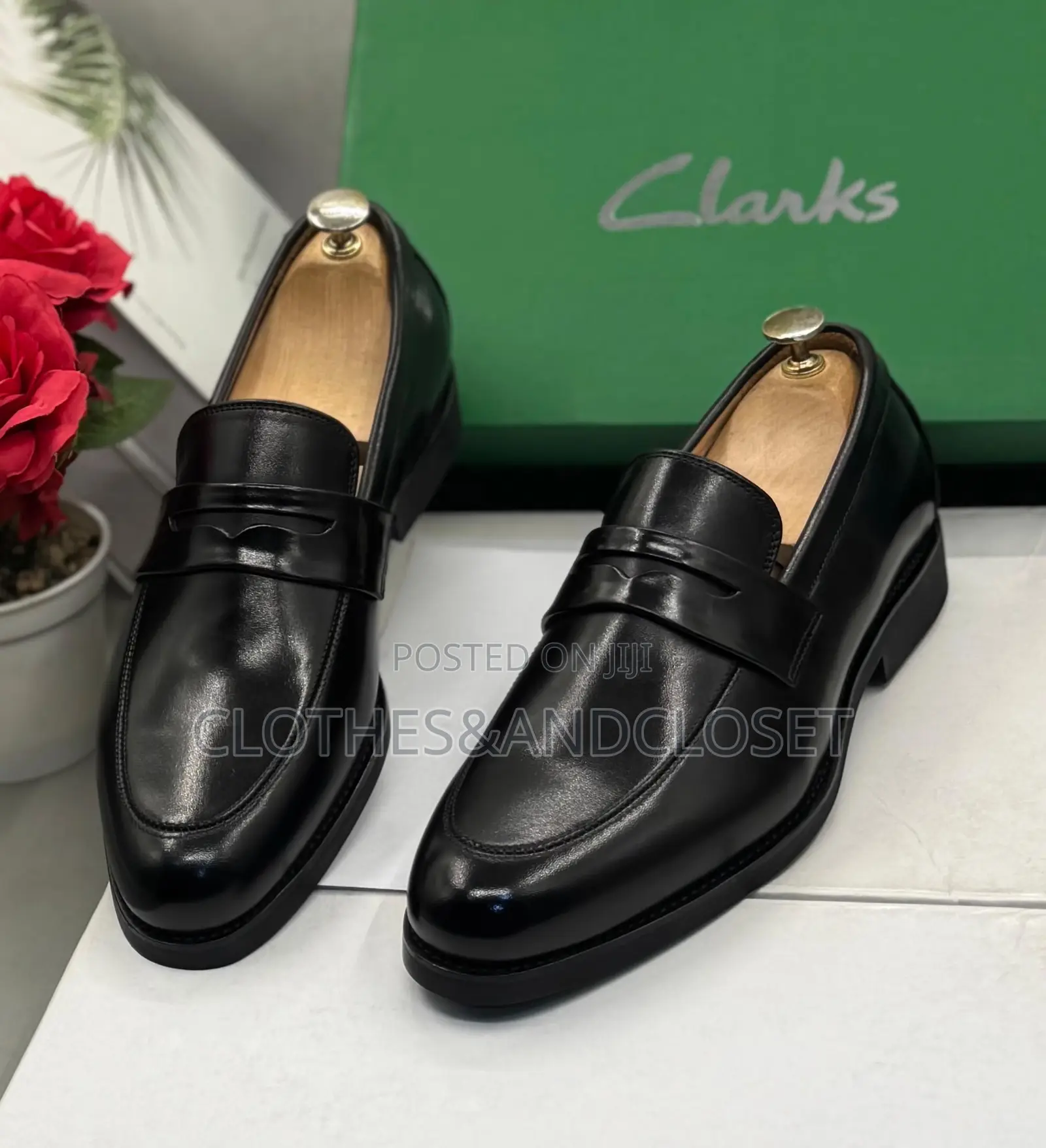 Clarks Black Leather Penny Loafers Featuring a Classic Slip-on Design