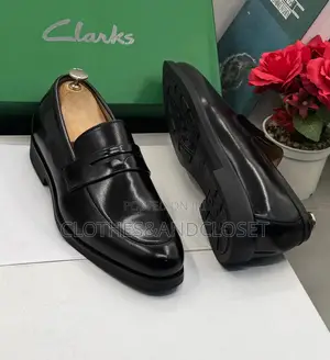 Clarks Black Leather Penny Loafers Featuring a Classic Slip-on Design
