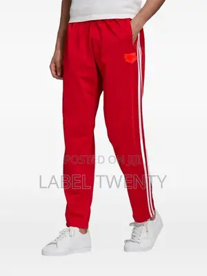 Red Tracksuit With Three White Stripes
