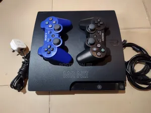 PS3 Slim With 2 Controllers and 15 Games