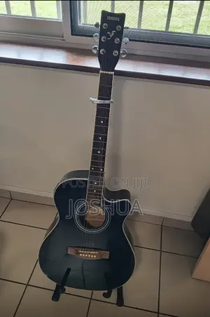 Yamaha Guitar Acoustic With Capo and Stand
