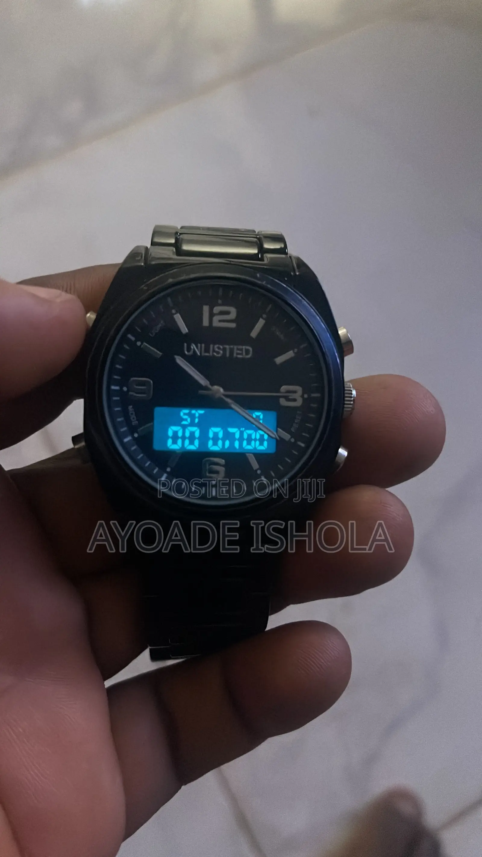 Kenneth Cole Unlisted Watch Features a Display Analog Digital Screen.