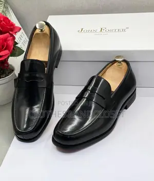 John Foster Black Leather Loafers Feature a Classic Penny Slot Design