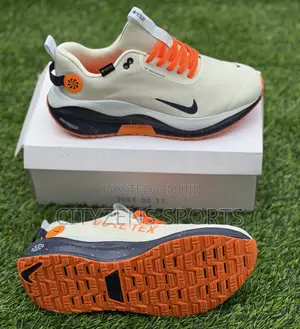 Nike Off White and Orange Trainers