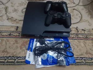 PS3 Slim Console + 10 Games Installed+ 2 Controllers