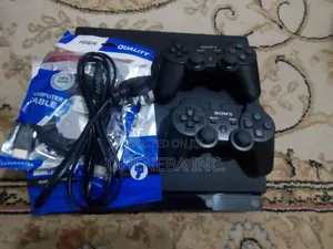 PS3 Slim Console + 10 Games Installed+ 2 Controllers