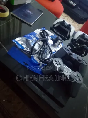 PS3 Slim Console + 10 Games Installed+ 2 Controllers